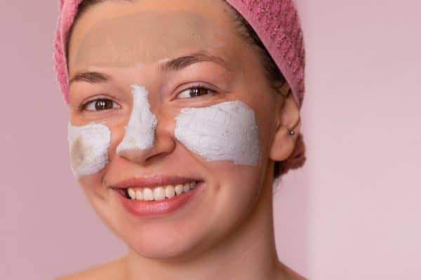 close-up-view-happy-woman-with-mask-face-home-cropped-pink-1080